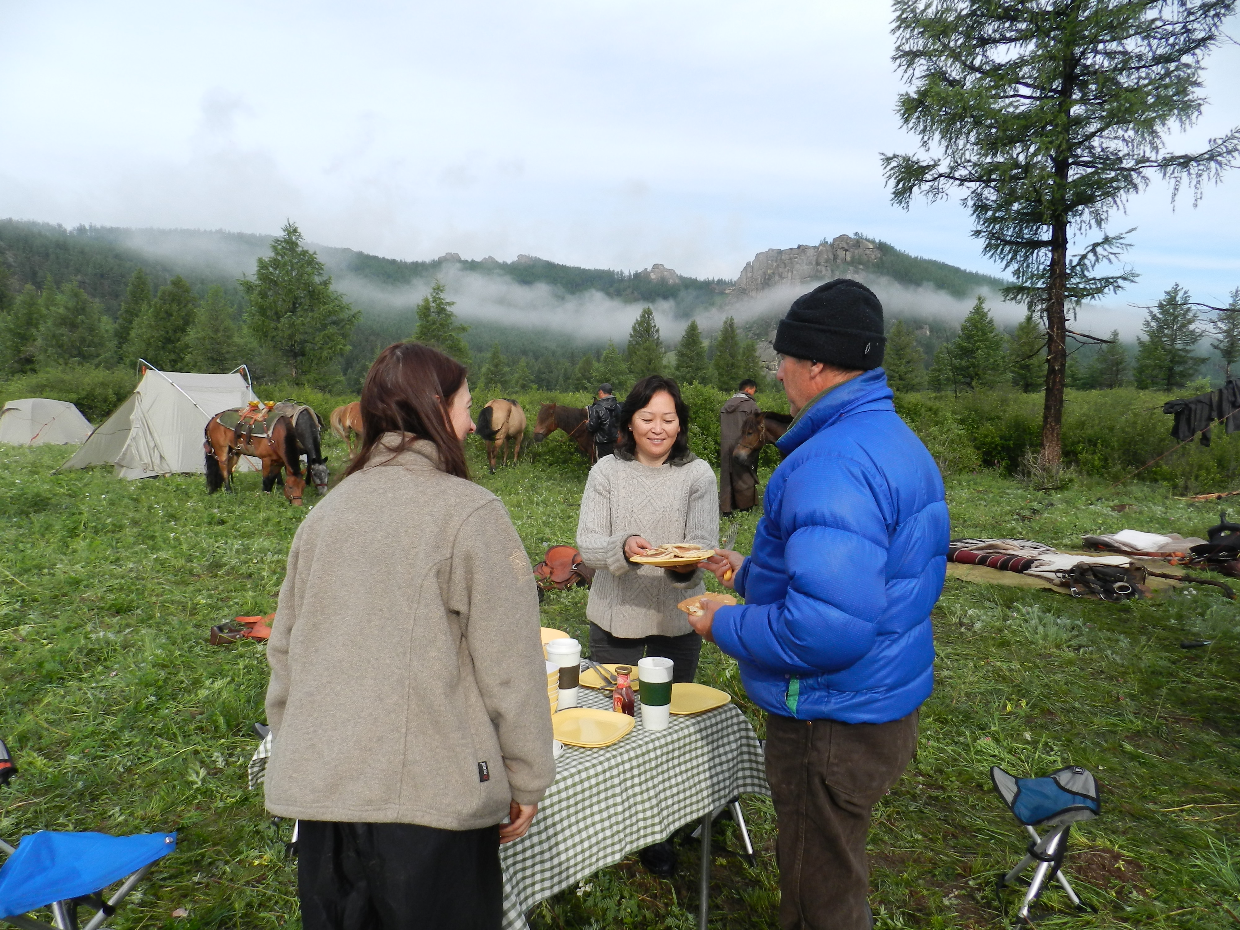 Down sweater, down jacket for camping in the Khentii Mountains in Mongolia